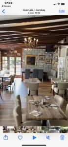 a dining room with a table and chairs and a dining room at Bennachie Lodge Hotel in Kemnay in Inverurie