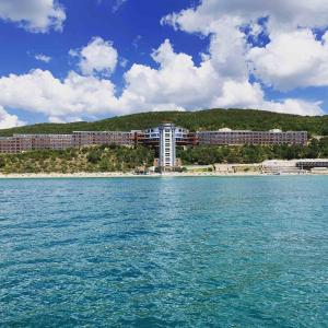 a view of a resort from the water at Paradise Beach Residence - Ultra All Inclusive in Sveti Vlas