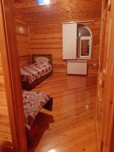 a small room with two beds in a cabin at My house in Buzovna in Baku