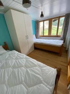 Un pat sau paturi într-o cameră la Sunnu-Loft