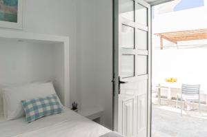 Postel nebo postele na pokoji v ubytování Pelican Paros