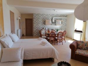 A bed or beds in a room at House with View in Amfithea
