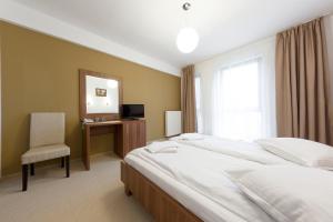 Postel nebo postele na pokoji v ubytování Hotel Mariss + 31 fotografií