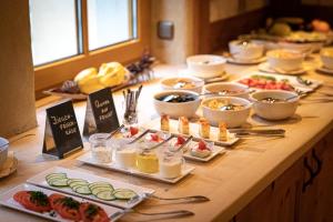 a buffet with many plates of food on a table at Hotel Sächsischer Hof in Pirna