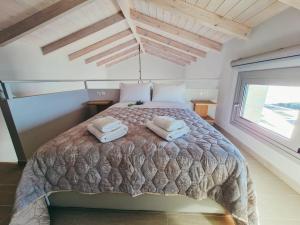 A bed or beds in a room at Owl Villas