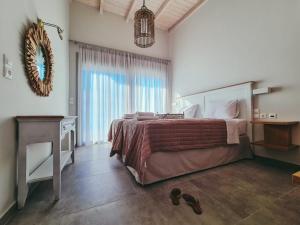 A bed or beds in a room at Owl Villas