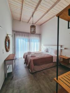 A bed or beds in a room at Owl Villas
