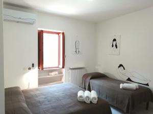 Voodi või voodid majutusasutuse B&B L'Altare Bianco toas