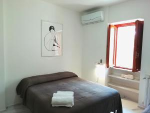 Voodi või voodid majutusasutuse B&B L'Altare Bianco toas
