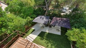 an overhead view of a table with an umbrella at Holiday Home Darko in Novalja