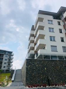 Budova, v ktorej sa apartmán nachádza + 4 fotografie