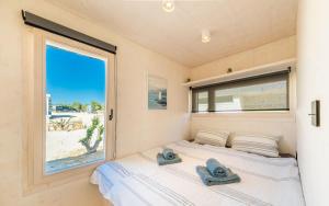 Buqez Resort Villa 46 tesisinde bir odada yatak veya yataklar