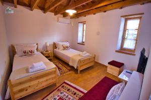 A bed or beds in a room at Argyropolis Boutique Hotel