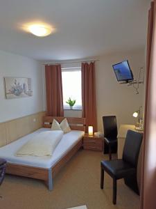 Postel nebo postele na pokoji v ubytování Hotel - Gasthof Erber