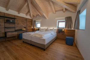 A bed or beds in a room at Agritur La Crucola