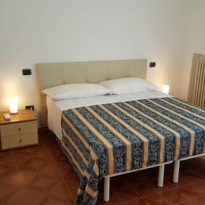Ліжко або ліжка в номері Appartamento 6 posti, con balconi vista mare