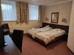 Postel nebo postele na pokoji v ubytování Mazowsze Medi Spa