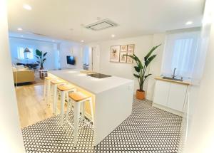 a kitchen with a white counter top and a sink at Casa Natura Elx in Elche