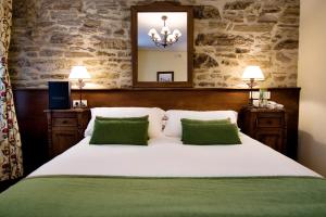 Posteľ alebo postele v izbe v ubytovaní San Clemente by Pousadas de Compostela