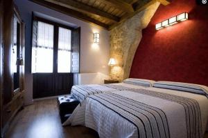A bed or beds in a room at Rincón de San Cayetano