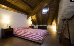 A bed or beds in a room at Rincón de San Cayetano