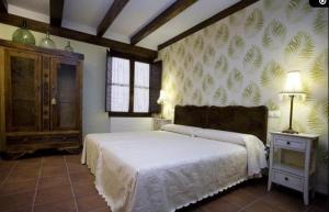 A bed or beds in a room at Rincón de San Cayetano