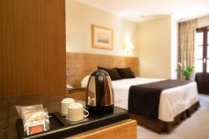 Posteľ alebo postele v izbe v ubytovaní Hotel San Juan de los Reyes