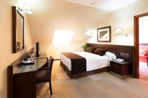 Posteľ alebo postele v izbe v ubytovaní Hotel San Juan de los Reyes