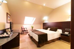 Posteľ alebo postele v izbe v ubytovaní Hotel San Juan de los Reyes