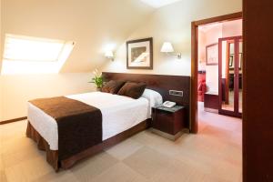 Posteľ alebo postele v izbe v ubytovaní Hotel San Juan de los Reyes