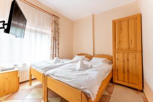 Posteľ alebo postele v izbe v ubytovaní Varázskő Apartman Gyula