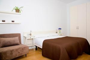 Posteľ alebo postele v izbe v ubytovaní Claris Apartments