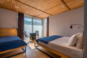 Llit o llits en una habitació de Vache Hotel