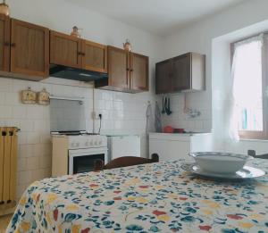 a kitchen with a table with a bowl on it at CASA SILVANA in Equi Terme