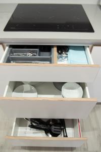 A kitchen or kitchenette at APARTAMENTOS CUME DO PINDO