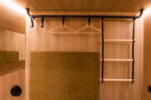 a bathroom with a shower with four racks at CAB20 in Hamburg