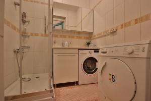 a bathroom with a washing machine and a sink at Youkali hause in Istanbul