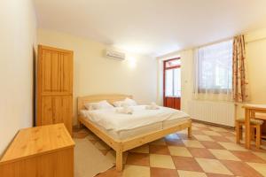Posteľ alebo postele v izbe v ubytovaní Varázskő Apartman Gyula