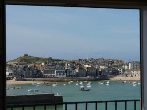 a view of a harbor with boats in the water at Harbour View House in St Ives