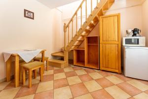 Kuchyňa alebo kuchynka v ubytovaní Varázskő Apartman Gyula