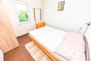 Postel nebo postele na pokoji v ubytování Apartments Emma