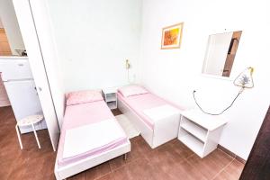 Postel nebo postele na pokoji v ubytování Apartments Emma