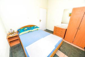 Postel nebo postele na pokoji v ubytování Apartments Emma