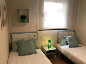 Posteľ alebo postele v izbe v ubytovaní Telma-Playa Gran terraza by AlohaMalaga