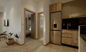 a living room with a television and a sliding door at Casa Costa Suites in Kanali