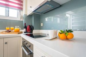 A kitchen or kitchenette at Olga's Organic garden Home for a couple! with Wifi & AC