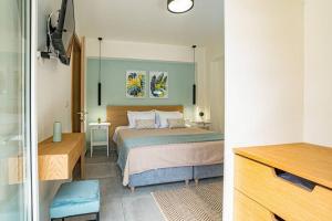 A bed or beds in a room at Olga's Organic garden Home for a couple! with Wifi & AC