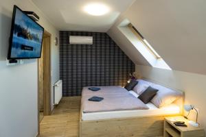 Кровать или кровати в номере Star Apartman