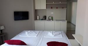 Ліжко або ліжка в номері Twister Apartments