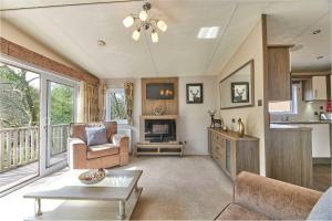 a living room with a couch and a table at Host & Stay - Yolo Lodge in Felton